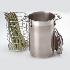 Steamers & Poachers - Tall, slender pot cooks asparagus evenly by holding it upright, with the tender tips farthest from the heat source, the woody stems just above the boiling water. Crafted of 18/10 stainless steel with an aluminum disk sandwiched in the base for fast, even heating. Polished interior cleans easily; satin exterior finish. Made in the China. - Specifications 5-3/4" Dia. X 8-3/4" H.