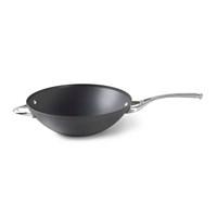 12-inch flat-bottom wok. Triple-layer PFOA-free nonstick. Heavy-gauge, hard-anodized aluminum. Cast stainless steel loop handles. Dishwasher safe for easy cleanup. Oven safe to 450 degrees Fahrenheit. Drawing its inspiration from traditional woks, the Calphalon Contemporary Nonstick 12 in. Flat Bottom Wok features a flat bottom for easy stir-frying on electric or gas ranges. Yet its construction is truly modern, thanks to a triple-layer PFOA-free nonstick surface that's so tough it can be placed in the dishwasher. The heavy-gauge, hard-anodized aluminum promotes even heating, and the loop handles are made of cast stainless steel. Oven safe up to 450 degrees, this wok includes a manufacturer's lifetime warranty. About CalphalonCalphalon's mission is to be the culinary authority in kitchenwares, enhancing the home chef's food experience during planning, prep, cooking, baking, and serving. Based in Toledo, Ohio, Calphalon is a leading manufacturer of professional quality cookware, cutlery, bakeware, and kitchen accessories for the home chef. Calphalon is a Newell-Rubbermaid company. Calphalon's goal is to give you, the home chef, all the tools you need to realize your highest potential in the kitchen. From your holiday roasting pan to your everyday fry pan, count on Calphalon to be your culinary partner - day in and day out, for breakfast, lunch, and dinner for a lifetime.