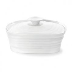 Made of high-quality porcelain. Beautiful rectangular butter dish in white. Durable light-weight and easy to use. Microwave- and dishwasher-safe. Dimensions: 6.25L x 5W x 3.25H inches. Your butter is begging for the Sophie Conran White Covered Butter Dish. This simple porcelain dish easily goes from the counter to the table and back, and looks at home wherever you place it. It'll blend perfectly with your gourmet spread, yet is durable enough for everyday use. Plus, cleanup is easy, simple pop it in the dishwasher. About PortmeirionStrikingly beautiful, eminently practical, refreshingly affordable. These are the enduring values bequeathed to Portmeirion by its legendary co-founder and designer, Susan Williams-Ellis. Her father, architect Sir Clough Williams-Ellis, was the designer of Portmeirion, the North Wales village whose fanciful architecture has drawn tourists and artists from around the world (including the creators of the classic 1960s TV show The Prisoner). Inspired by her fine arts training and creation of ceramic gifts for the village's gift shop, Susan Williams-Ellis (along with her husband Euan Cooper-Willis) founded Portmeirion Pottery in 1960. After 50+ years of innovation, the Portmeirion Group is not only an icon of British design, but also a testament to the extraordinarily creative life of Susan Williams-Ellis. The style of Portmeirion dinnerware and serveware is marked by a passion for both pottery manufacturing and trend-setting design. Beautiful, tactile, nature-inspired patterns are a defining quality of Portmeirion housewares, from its world-renowned botanical designs modeled on antiquarian books to the breezy, natural colors of its porcelain and earthenware. Today, the Portmeirion Group's design legacy continues to evolve, through iconic brands such as Spode, the Pomona Classics collection, and the award-winning collaboration of Sophie Conran for Portmeirion. Sophie Conran for Portmeirion: Successful collaborations have provided design inspiration throughout Sophie Conran's life. Her father, designer Sir Terence Conran, and mother, food writer Caroline Conran, have been the pillars of her eclectic mix of cooking, writing, and interior design. In pairing with the iconic British housewares brand Portmeirion, Conran has created another successful collaboration: Sophie Conran for Portmeirion, an award-winning collection of dinnerware, serveware, and drinkware for the practical, multi-functional needs of contemporary kitchens. Launched in 2006, Sophie Conran for Portmeirion immediately received the Elle Deco Style Award for Best in Kitchens, and two years later, the House Beautiful Award for Best in Tableware. The soulful, tactile beauty of these oven-to-tableware pieces is exemplified by rippled surfaces and edges that evoke a potter's hand. This down-to-earth style is complemented by charming pastels, gentle earth tones, and classic whites and pinks, for a collection that will lighten and enliven contemporary kitchen decors. Though delicate to the eye and touch, these plates and bowls are built for durable performance, with microwave- and dishwasher-safe porcelain that's casual enough for breakfast and elegant enough for eye-catching dinners.