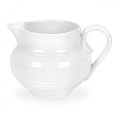 Made of high-quality porcelain. Modern, organic rim styling and ridges. Holds up to 10 ounces. Microwave- and dishwasher-safe. Dimensions: 4.8L x 4.2W x 4.2H inches. You'll love the simple design of the Sophie Conran White Cream Jug. Crafted of durable porcelain, this small jug will fit right in with the rest of your coffee or tea service. Pull it out for special occasions or use it everyday - it's microwave- and dishwasher- safe. About PortmeirionStrikingly beautiful, eminently practical, refreshingly affordable. These are the enduring values bequeathed to Portmeirion by its legendary co-founder and designer, Susan Williams-Ellis. Her father, architect Sir Clough Williams-Ellis, was the designer of Portmeirion, the North Wales village whose fanciful architecture has drawn tourists and artists from around the world (including the creators of the classic 1960s TV show The Prisoner). Inspired by her fine arts training and creation of ceramic gifts for the village's gift shop, Susan Williams-Ellis (along with her husband Euan Cooper-Willis) founded Portmeirion Pottery in 1960. After 50+ years of innovation, the Portmeirion Group is not only an icon of British design, but also a testament to the extraordinarily creative life of Susan Williams-Ellis. The style of Portmeirion dinnerware and serveware is marked by a passion for both pottery manufacturing and trend-setting design. Beautiful, tactile, nature-inspired patterns are a defining quality of Portmeirion housewares, from its world-renowned botanical designs modeled on antiquarian books to the breezy, natural colors of its porcelain and earthenware. Today, the Portmeirion Group's design legacy continues to evolve, through iconic brands such as Spode, the Pomona Classics collection, and the award-winning collaboration of Sophie Conran for Portmeirion. Sophie Conran for Portmeirion: Successful collaborations have provided design inspiration throughout Sophie Conran's life. Her father, designer Sir Terence Conran, and mother, food writer Caroline Conran, have been the pillars of her eclectic mix of cooking, writing, and interior design. In pairing with the iconic British housewares brand Portmeirion, Conran has created another successful collaboration: Sophie Conran for Portmeirion, an award-winning collection of dinnerware, serveware, and drinkware for the practical, multi-functional needs of contemporary kitchens. Launched in 2006, Sophie Conran for Portmeirion immediately received the Elle Deco Style Award for Best in Kitchens, and two years later, the House Beautiful Award for Best in Tableware. The soulful, tactile beauty of these oven-to-tableware pieces is exemplified by rippled surfaces and edges that evoke a potter's hand. This down-to-earth style is complemented by charming pastels, gentle earth tones, and classic whites and pinks, for a collection that will lighten and enliven contemporary kitchen decors. Though delicate to the eye and touch, these plates and bowls are built for durable performance, with microwave- and dishwasher-safe porcelain that's casual enough for breakfast and elegant enough for eye-catching dinners.