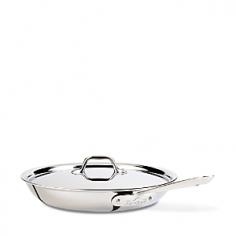 All-Clad Stainless Steel 12? Fry Pan with Lid Perfect Frying, Every Time! Sear, brown and pan fry everything from eggs to meat with the All-Clad Stainless Steel 12-Inch Covered Fry Pan. This pan's flat bottom and flared sides make it easy to toss or turn food with a spatula. Three-ply stainless steel construction offers exceptional heating performance even when using an induction cooktop. The 18/10 stainless steel is naturally stick resistant the extra-long stainless handle is riveted to the body providing an ergonomic and comfortable piece to use in any kitchen. This pan is ideal for cooking with oils and helps food develop rich flavor, bright color and crisp texture. The cast and riveted steel handle stays cool on the cooktop so you can cook safely and comfortably. Made in the USA. Lifetime warranty. About All-CladFor more than 40 years, All-Clad has manufactured top of the line cookware products revered by both working chefs and avid home cooks. All-Clad pieces feature an innovative blend of aluminum, copper and steel and are made in the USA. This Pennsylvania based company regards the quality of its products with the utmost importance, going through rigorous hand inspection at every stage in the process of manufacturing. All-Clad also values environmentally friendly production, recycling materials whenever possiblethey even re-use the metal dust created during sanding. All-Clad Stainless CookwareThe Stainless line is compatible with all cooktop types, including induction. Premium Stainless Steel Construction Classic Design, high performance and lifetime durability unite in the Stainless Collection, All-Clad's most popular line of cookware. Products in this collection feature an interior core of aluminum for even heating and a polished 18/10 stainless steel exterior and cooking surface for fine culinary performance. All-Clad stainless steel cookware featu