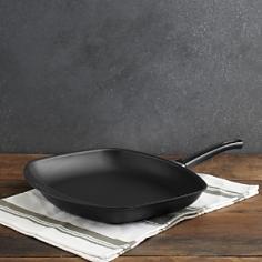 Fry Pans & Skillets - Every kitchen needs an everyday pan that requires no added fat and will not warp, peel, blister or crack. The ideal roomy size for browning, searing or frying nutritious foods for the whole family at once, the Scanpan Classic Rectangular Everyday Pan is one of the most versatile nonstick cookware pieces ever produced. Scanpan Classic is the only cookware that combines long-term nonstick ease with dishwasher-safe convenience and Old World craftsmanship. The Scanpan everyday pan is pressure-cast of heavy-duty aluminum and fused with a ceramic-titanium surface. A patented Green Tek nonstick cooking layer is added that is free of PFOA and PFOS. Combining nonstick ease with dishwasher-safe convenience, the versatile nonstick cookware will not warp, peel, blister or crack and the fused ceramic titanium is virtually impossible to scrape off. An extra-thick aluminum base heats evenly with no hot spots and the ceramic-titanium nonstick surface is suited for any utensils, including metal. A pate - Specifications Material: cast aluminum, ceramic titanium, Bakelite Model: 42351200 Size: 11 1/4"L (19 3/4" with lip and handle) x 13 3/4"W x 2"H Base: 8 3/4" Dia. Weight: 3 lb. 8 oz. Cooking Surface: 9 1/2"l X 10 1/2"w Made in Denmark Use and Care Before using for the first time, hand wash your Scanpan everyday pan in warm soapy water. After each use, wash the Scanpan cookware in the dishwasher or hand wash with warm soapy water while it is still warm. The everyday pan should be completely clean before storing. Do not use aerosol sprays. Do not overheat. Do not use to store food. Burn marks due to overheating or charring of fatty substances can be removed by filling 3/4 full with water, adding a dessert spoon of dishwashing liquid and simmering for 15 minutes. Then rinse and scrub as usual. Some signs of normal wear and tear will not affect the nonstick finish.