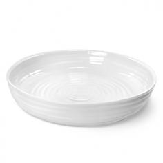Constructed from high-quality porcelain. Modern, everyday style. Round roasting dish in white. Microwave- and dishwasher-safe. Dimensions: 11 diam. x 5H inches. Mom's pot roast requires a sturdy pan and the Sophie Conran White Round Roasting Dish is it. Crafted of durable porcelain, this versatile pan is designed to go from oven to table. It's dishwasher-safe and you can also pop it in the freezer or microwave. Use just one pan from start to finish, now that's efficient. Mom would be proud. About PortmeirionStrikingly beautiful, eminently practical, refreshingly affordable. These are the enduring values bequeathed to Portmeirion by its legendary co-founder and designer, Susan Williams-Ellis. Her father, architect Sir Clough Williams-Ellis, was the designer of Portmeirion, the North Wales village whose fanciful architecture has drawn tourists and artists from around the world (including the creators of the classic 1960s TV show The Prisoner). Inspired by her fine arts training and creation of ceramic gifts for the village's gift shop, Susan Williams-Ellis (along with her husband Euan Cooper-Willis) founded Portmeirion Pottery in 1960. After 50+ years of innovation, the Portmeirion Group is not only an icon of British design, but also a testament to the extraordinarily creative life of Susan Williams-Ellis. The style of Portmeirion dinnerware and serveware is marked by a passion for both pottery manufacturing and trend-setting design. Beautiful, tactile, nature-inspired patterns are a defining quality of Portmeirion housewares, from its world-renowned botanical designs modeled on antiquarian books to the breezy, natural colors of its porcelain and earthenware. Today, the Portmeirion Group's design legacy continues to evolve, through iconic brands such as Spode, the Pomona Classics collection, and the award-winning collaboration of Sophie Conran for Portmeirion. Sophie Conran for Portmeirion: Successful collaborations have provided design inspiration throughout Sophie Conran's life. Her father, designer Sir Terence Conran, and mother, food writer Caroline Conran, have been the pillars of her eclectic mix of cooking, writing, and interior design. In pairing with the iconic British housewares brand Portmeirion, Conran has created another successful collaboration: Sophie Conran for Portmeirion, an award-winning collection of dinnerware, serveware, and drinkware for the practical, multi-functional needs of contemporary kitchens. Launched in 2006, Sophie Conran for Portmeirion immediately received the Elle Deco Style Award for Best in Kitchens, and two years later, the House Beautiful Award for Best in Tableware. The soulful, tactile beauty of these oven-to-tableware pieces is exemplified by rippled surfaces and edges that evoke a potter's hand. This down-to-earth style is complemented by charming pastels, gentle earth tones, and classic whites and pinks, for a collection that will lighten and enliven contemporary kitchen decors. Though delicate to the eye and touch, these plates and bowls are built for durable performance, with microwave- and dishwasher-safe porcelain that's casual enough for breakfast and elegant enough for eye-catching dinners.