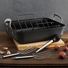 16-inch nonstick roaster set. Heavy-gauge, hard-anodized aluminum. Cast stainless steel loop handles. Dishwasher safe for easy cleanup. Oven safe to 450 degrees Fahrenheit. Manufacturer's full lifetime warranty. Make the most of your roast with the Calphalon Contemporary Nonstick 16 in. Roaster Set. Perfectly sized for large turkeys, hams, and roasts, this set comes complete with a 16-inch roaster, nonstick rack, injection baster, and two stainless steel lifters. The quadruple-riveted handles make lifting and turning easy, and the roaster goes from stovetop to oven (up to 450 degrees Fahrenheit). Plus, both rack and pan feature PFOA-free, triple-layer nonstick that's so tough it's dishwasher safe. Cast stainless steel loop handles and heavy-gauage, hard-anodized aluminum for even heating complete the roaster's design. Includes Calphalon's lifetime manufacturer's warranty. About CalphalonCalphalon's mission is to be the culinary authority in kitchenwares, enhancing the home chef's food experience during planning, prep, cooking, baking, and serving. Based in Toledo, Ohio, Calphalon is a leading manufacturer of professional quality cookware, cutlery, bakeware, and kitchen accessories for the home chef. Calphalon is a Newell-Rubbermaid company. Calphalon's goal is to give you, the home chef, all the tools you need to realize your highest potential in the kitchen. From your holiday roasting pan to your everyday fry pan, count on Calphalon to be your culinary partner - day in and day out, for breakfast, lunch, and dinner for a lifetime.